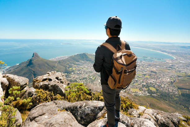 istock a man taking in view on Table Mountain, Cape Town 1196510277