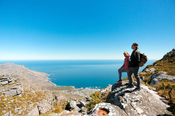 istock a man taking in view on Table Mountain, Cape Town 1196510313