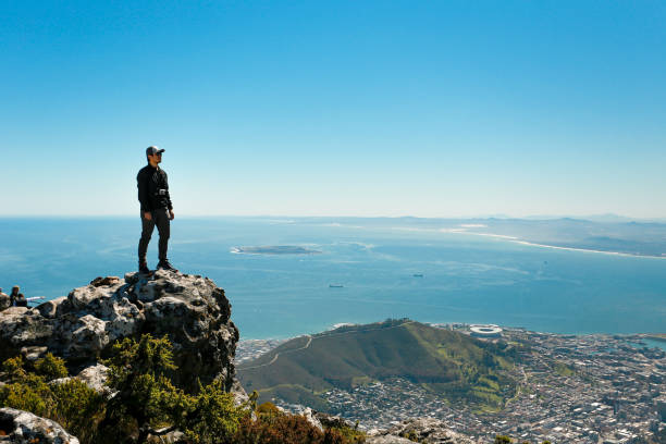 istock a man taking in view on Table Mountain, Cape Town 1196510835