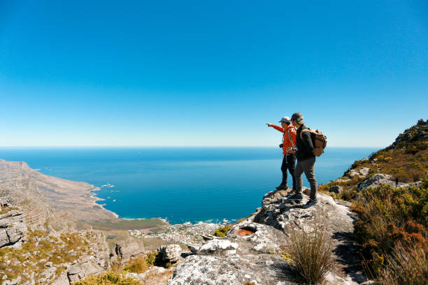 istock a man taking in view on Table Mountain, Cape Town 1196510845