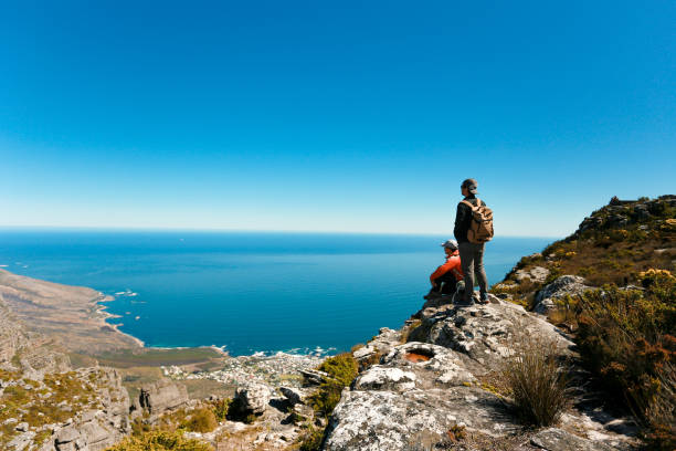 istock a man taking in view on Table Mountain, Cape Town 1196511028