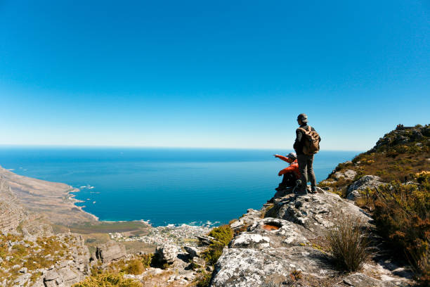 istock a man taking in view on Table Mountain, Cape Town 1196511033