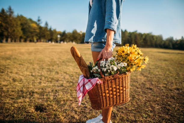 istock Woman holding picnic basket 1196511052