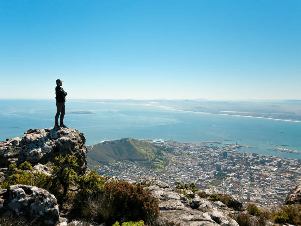 istock a man taking in view on Table Mountain, Cape Town 1196511243