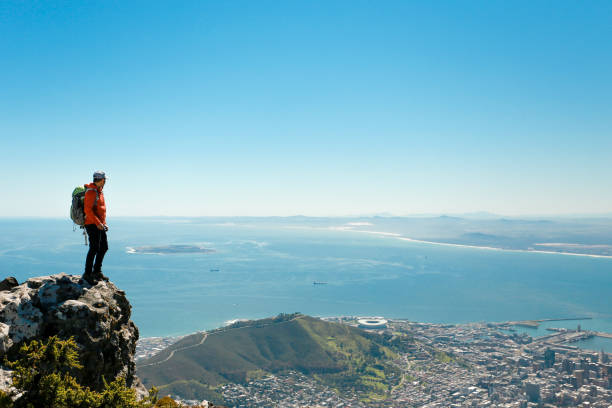 istock a man taking in view on Table Mountain, Cape Town 1196511270