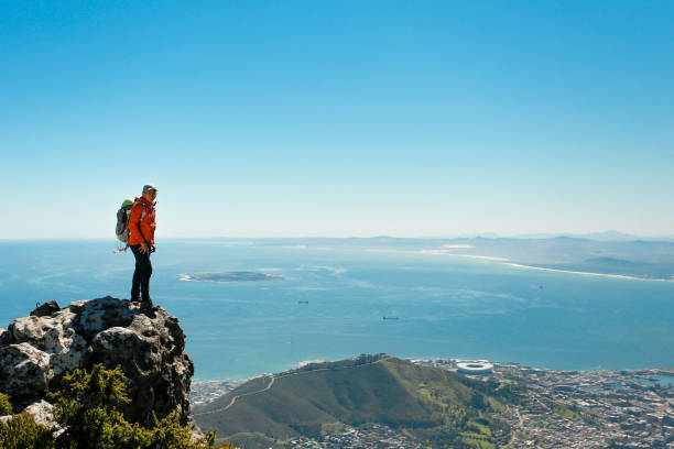istock a man taking in view on Table Mountain, Cape Town 1196511318