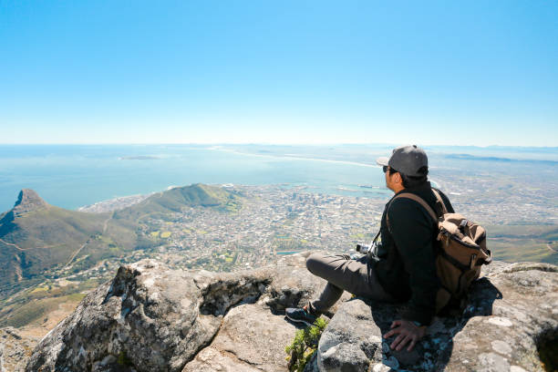 istock a man taking in view on Table Mountain, Cape Town 1196511467