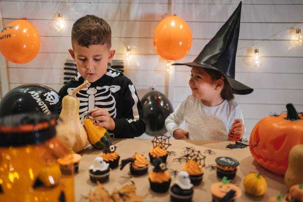 istock Children playing with Halloween decoration 1196511551