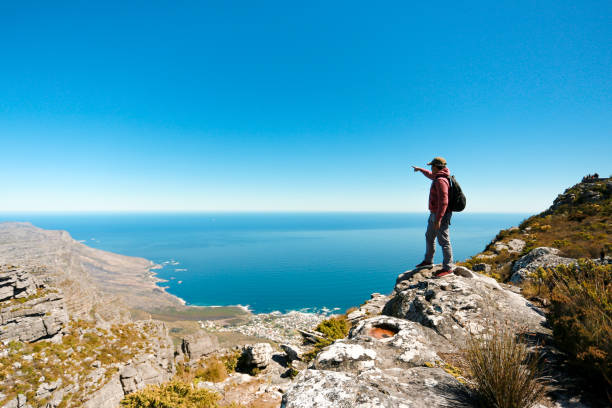 istock a man taking in view on Table Mountain, Cape Town 1196511750
