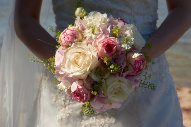 istock bride holding wedding bouquet 1196513823