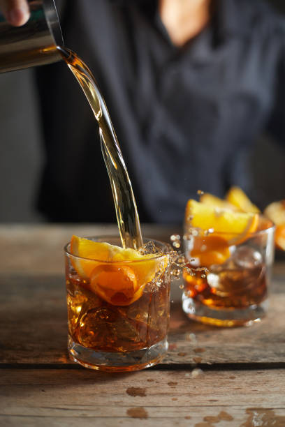 istock Tasty alcoholic old fashioned cocktail with orange slice 1196514176