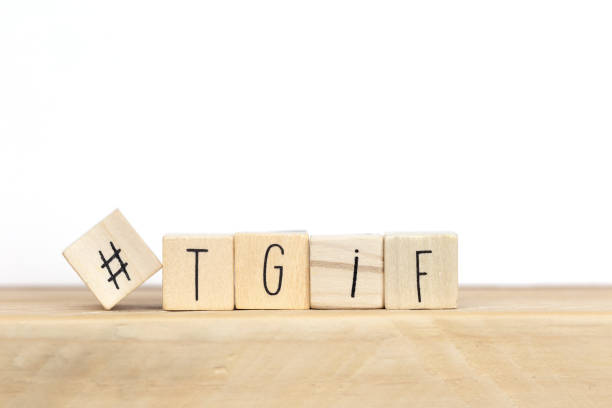 Wooden cubes with Hashtag and the word tgif, meaning Thank god its Friday, social media concept background stock photo