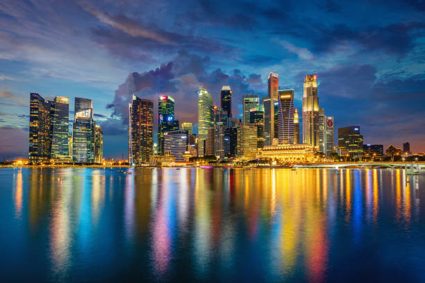 Singapore Marina Bay Cityscape Panorama at Dusk Central Business District in Singapore at Dusk. Beautiful Reflections on the water of Marina Bay. Singapore City, Central Business District, Asia. association of southeast asian nations photos stock pictures, royalty-free photos & images
