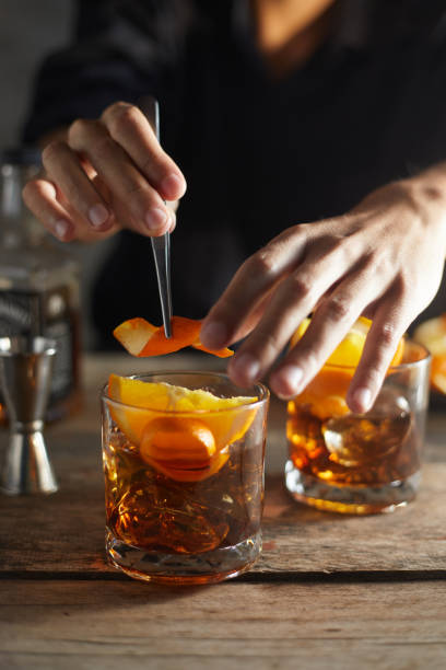 istock Tasty alcoholic old fashioned cocktail with orange slice 1196514754