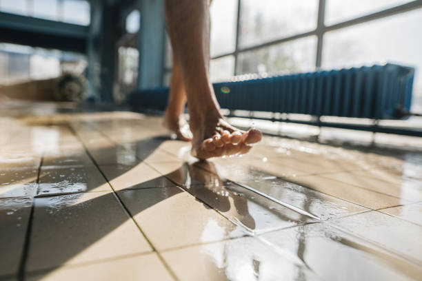 Barefoot man walking by the poolside Mature man, relaxing by the pool, swimming, and stretching Barefoot stock pictures, royalty-free photos & images