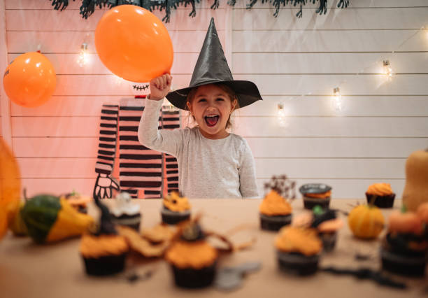 istock Smiling little girl dressed as a witch for Halloween 1196516317