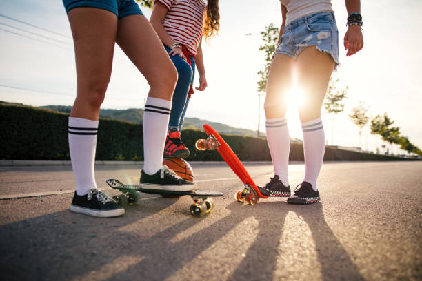 Three teenage female friends having fun outdoor