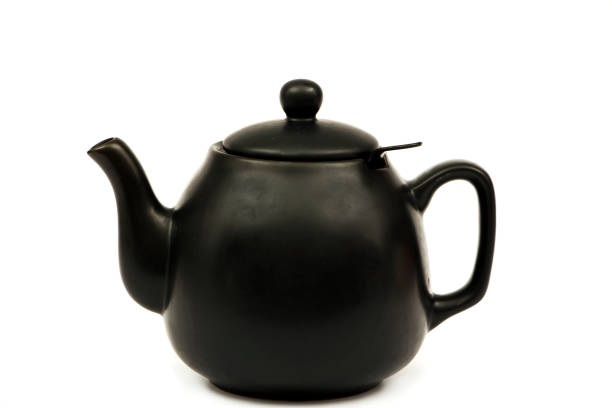 istock Black ceramic teapot for tea Isolated on a white background. Black teapot for tea on a white background. 1196518009