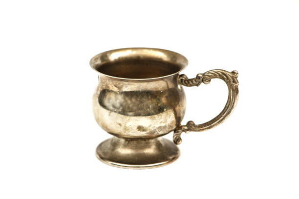 istock Set of silver dishes for tea or coffee Isolated on a white background. Silver tea or coffee set of utensils on a white background. 1196518018