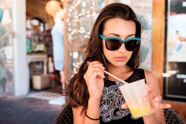 Pretty girl drinking a smoothie