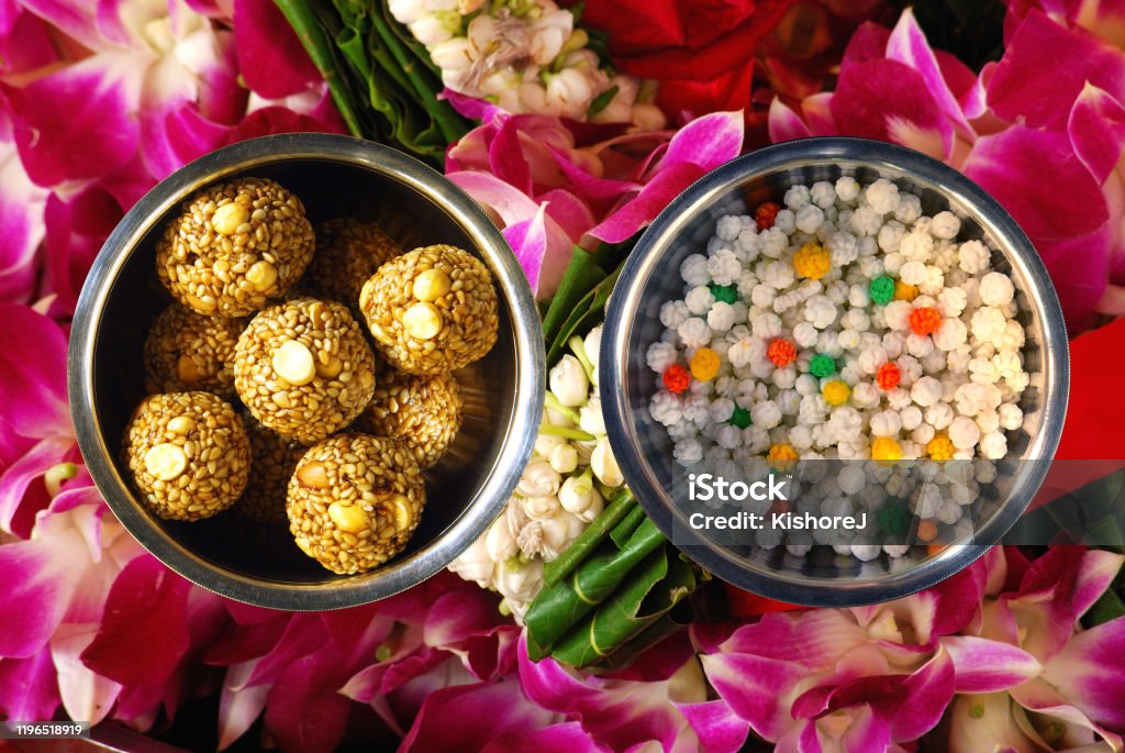 During Makar Sankranti, a festival celebrated on a large scale in Maharashtra state of India in the month of January every year, Til (Sesame) Laddoos & Til Gools are widely distributed During Makar Sankranti, a festival celebrated on a large scale in Maharashtra state of India in the month of January every year, Til (Sesame) Laddoos & Til Gools are widely distributed as Til (sesame) generates body heat. Makar Sankranti Stock Photo