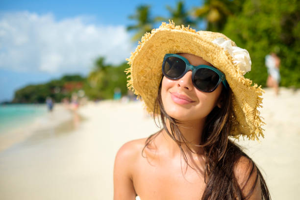 istock Beautiful girl at the beach 1196519073