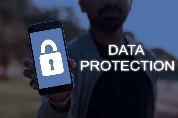 istock Cybersecurity and data protection concept with a person showing smartphone screen with lock symbol. 1196519364