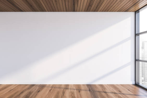 istock Empty white room with wooden floor 1196520609