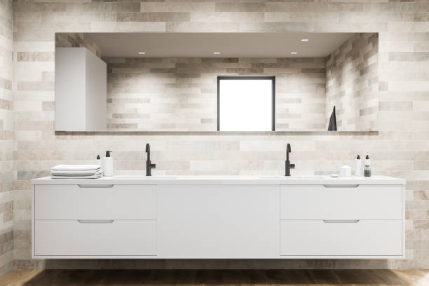istock Double sink in light tile bathroom interior 1196522587