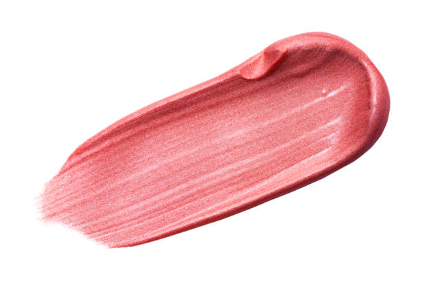 istock Lip gloss isolated on white. Smudged pink makeup product sample. 1196523425