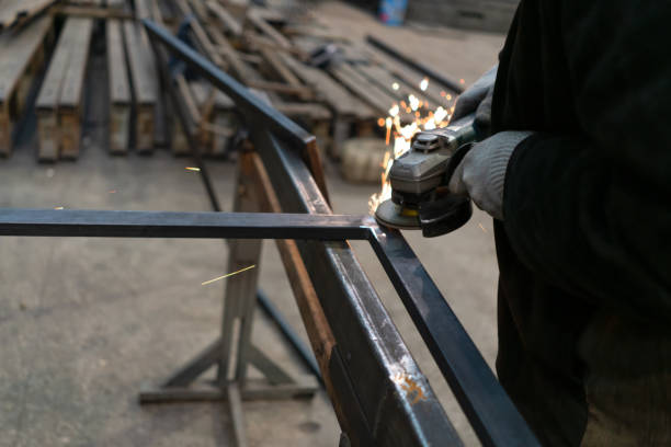 istock work with a circular saw for metal. sparks stripping metal seams. 1196524965