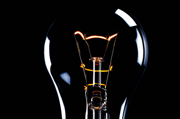 istock Clean image of glowing light bulb on black 119652875