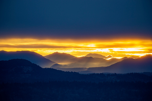 Foggy sunrise over Cascade Mountain Range, WA