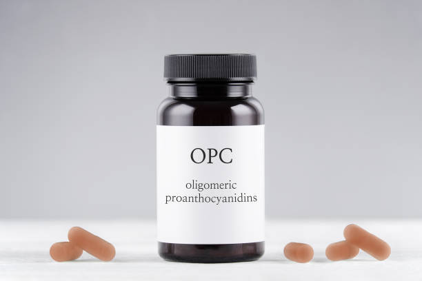 istock nutritional supplement opc grape seed extract bottle and capsules on gray background 1196531108