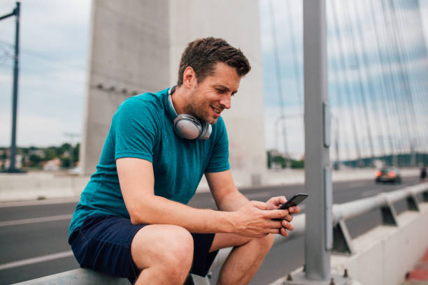 istock Man sitting on the fence 1196531734