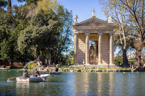 March 11, 2017 - Rome, Italy: tourists in front Neoclassical temple and pond in the Villa Borghese Park, Rome Italy