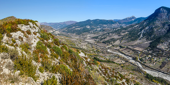 Panoramic view of Eygues river valley from Saint Laurent Plateau in Baronnies Natural Regional park. The top of Vautour de Remuzat is at left. Drome, Auvergne-Rhone-Alpes region in France.