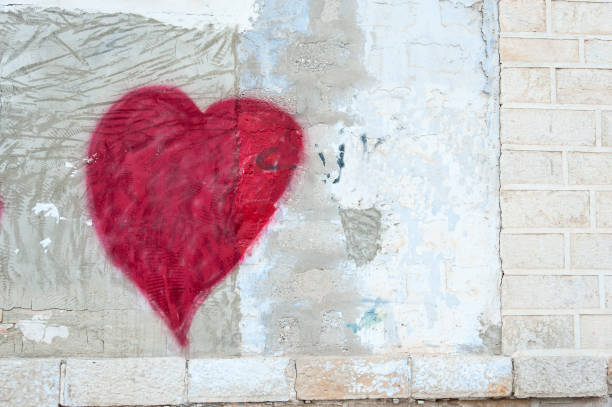 istock Heart shaped painting on a wall 1196532548