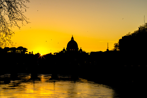 Saint Peter's basilica silhouette at sunset, Rome. Italy
