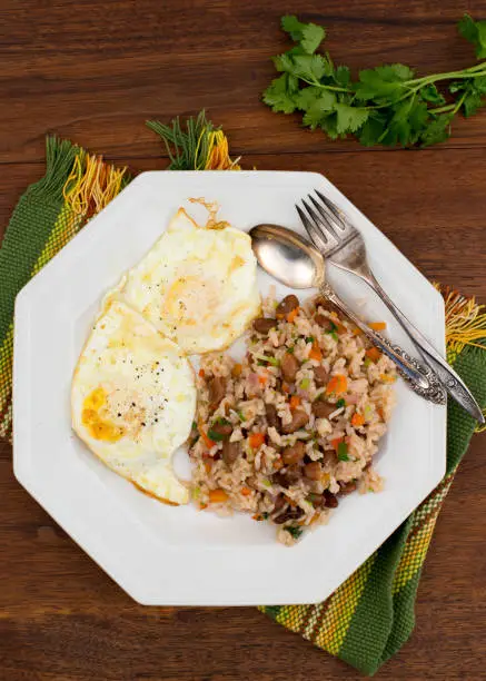 Traditional Costa Rican cuisine, Gallo Pinto.  Salsa Lizano, rice, red beans, peppers and cilantro etc. are among the ingredients.