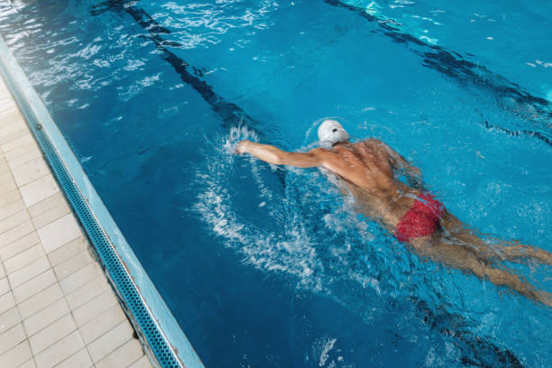 istock Mature athlete swimming in swimming pool 1196537496