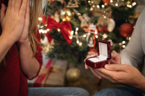istock Boyfriend proposing girlfriend on Christmas Eve 1196537526