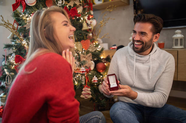 istock Boyfriend proposing girlfriend on Christmas Eve 1196539320