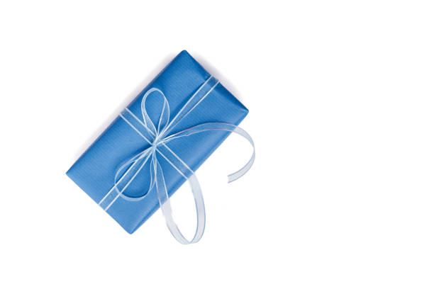 Open book on a black background. Textbook with blue endpapers. Hardcover. Knowledge, reading. Selective focus.