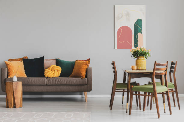 istock Vintage style grey living room interior with trendy sofa 1196542825