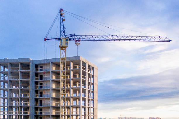 istock Construction site. High-rise multi-storey buildings under construction. Tower cranes near buildings 1196545745