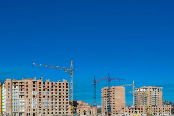 istock Construction site. High-rise multi-storey buildings under construction. Tower cranes near buildings 1196546911