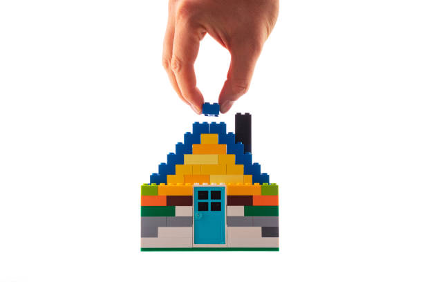 istock House made of classic building blocks and bricks, white studio background 1196549050