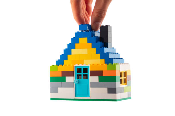 istock House made of classic building blocks and bricks, white studio background 1196549054