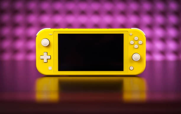 Nintendo Switch Lite is Nintendo's latest entry into handheld gaming. Priced at $199.99, the Switch Lite is available in yellow color MOSCOW, RUSSIA - October 08, 2019: Nintendo Switch Lite is Nintendo's latest entry into handheld gaming. Priced at $199.99, the Switch Lite is available in yellow color handheld video game stock pictures, royalty-free photos & images